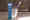 Spa toothpaste stands on table with toothbrush.